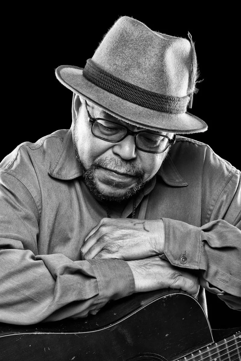 Black and white editorial portrait of musician Larry Garner