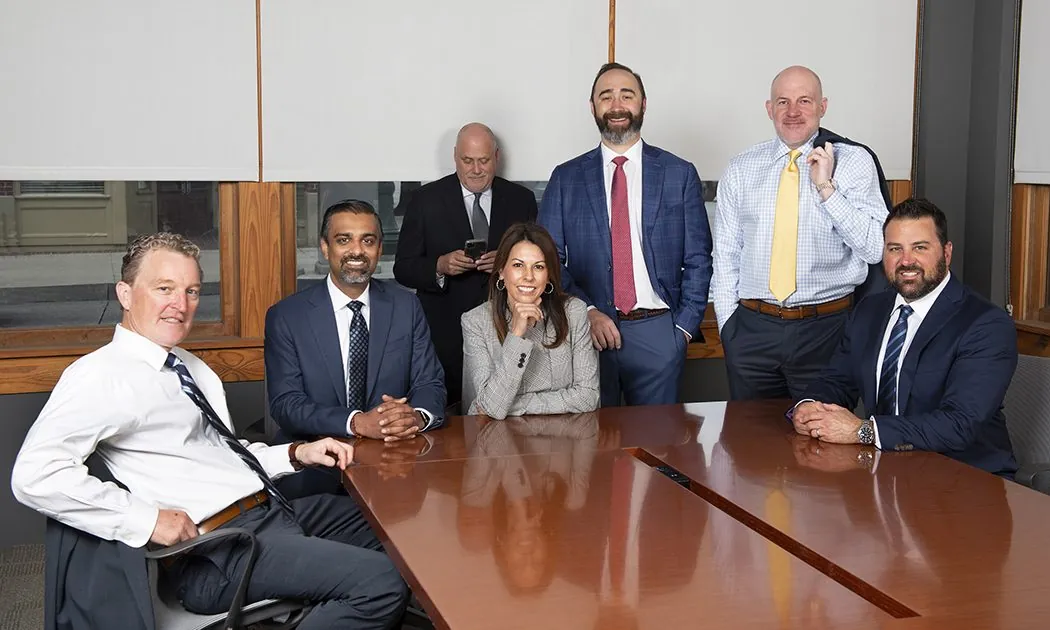 Executive team group portrait in a boardroom
