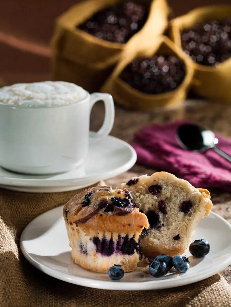 Coffee and blueberry muffin lifestyle photograph