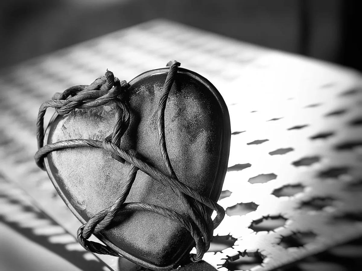 Black and white still life of a bound heart