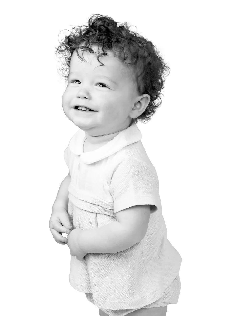 Black and white studio portrait of a young child